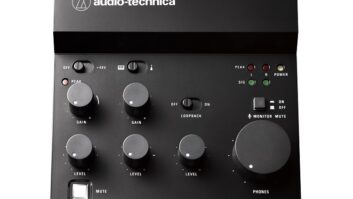 A small black audio mixer with simple controls