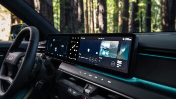 Interior of a Kia EV9 GT vehicle featuring a large electronic screen that sits in front of the driver and partway across the passenger space