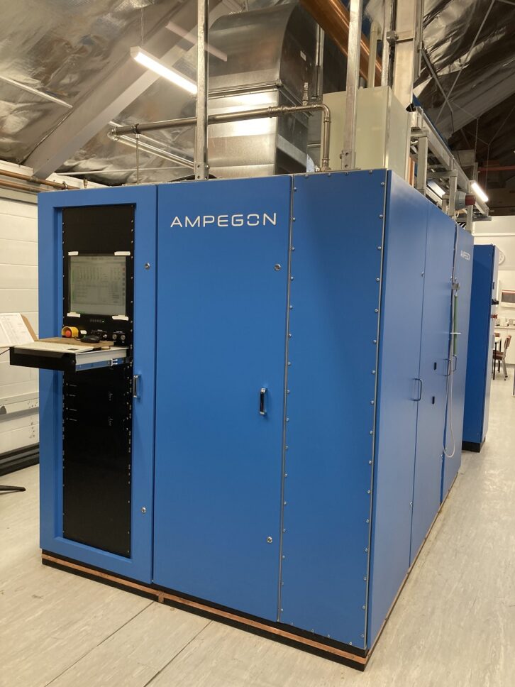 Ampegon transmitter, a large blue piece of equipment sitting in a utility room