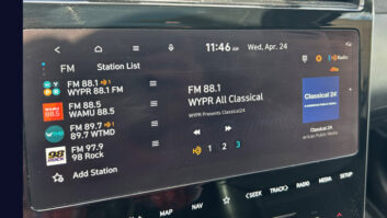 Closeup of car radio displaying metadata for WYPR