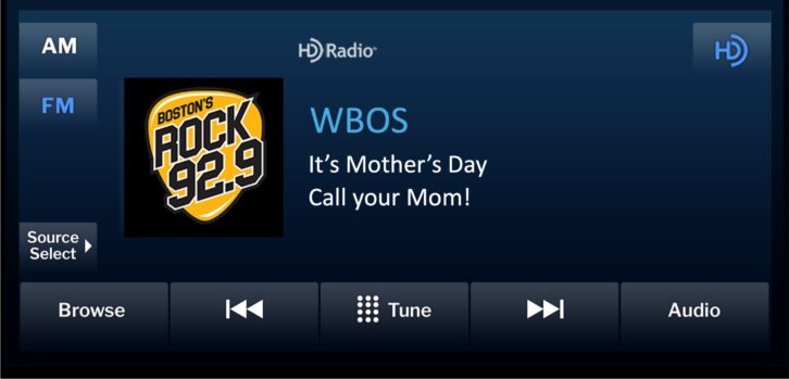 A radio display in a car dashboard bears the text message, "WBOS: It's Mother's Day. Call your Mom!"