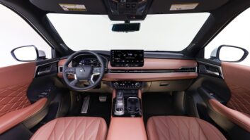 Interior view of an SUV vehicle with SiriusXM on the dashboard display