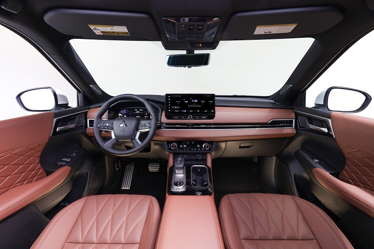 Interior view of an SUV vehicle with SiriusXM on the dashboard display