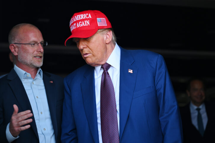 Brendan Carr, left, speaks with President-Elect Donald Trump