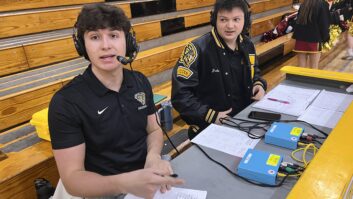 Max Swain and Jake Jira call a game. Sports Pods are on the table in front of them.